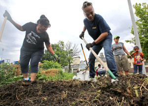 Photo by John Hart, State Journal archives.  Elisha Rosas, left, and Carla McCants till soil in a community garden near the Goodman Community Center on Madison's East Side. The pleasant, musky aroma after a rain is similar to what gardeners smell when they turn over their soil.