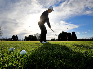 Cooper Armstrong of Madison works on his chipping game on Dec. 9 before a round at Odana Hills golf course, which reopened so golfers could take advantage of this month's warm temperatures. Photo credit:  John Hart, State Journal archives.
