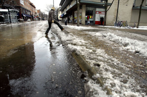 Though a slush puddle may look like a static, unchanging, boring and ugly mixture of dirty ice and water, it is actually an extremely dynamic cauldron of various phases of the magical water substance, constantly undergoing all manner of phase changes.  Photo credit:  Steve Apps, State Journal archives.